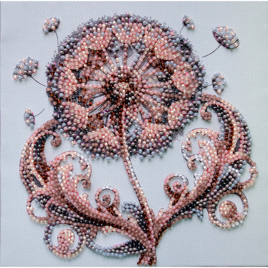 Decorative artwork of a floral design made with beads on a light blue background