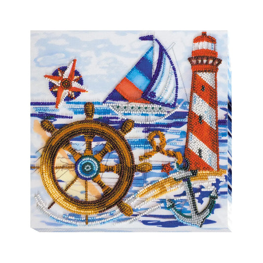 Decorative panel with nautical elements including a lighthouse, sailboat, steering wheel, and anchor on a blue wave background.