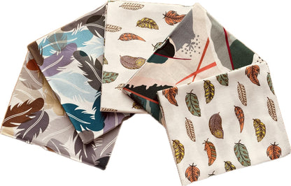 Set of four fabric swatches with feather patterns on a white background