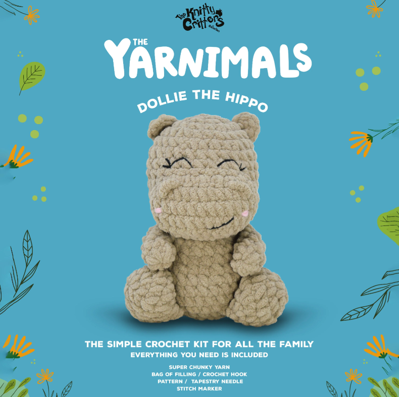 Crocheted hippo toy on a blue background with 'The Yarnimals' branding.