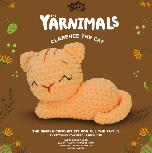 Crocheted cat toy with 'The Yarnimals' branding on a brown background