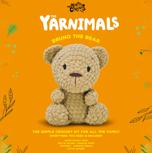 Crocheted bear toy on an orange background with 'The Yarnimals' branding.