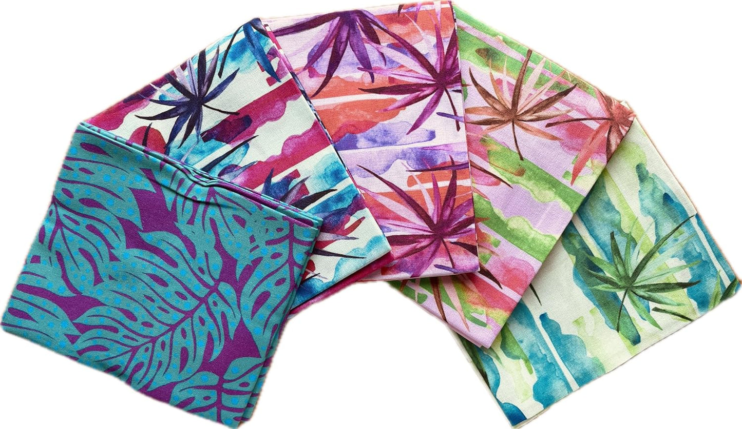 Set of colorful fabric swatches with tropical leaf patterns on a white background