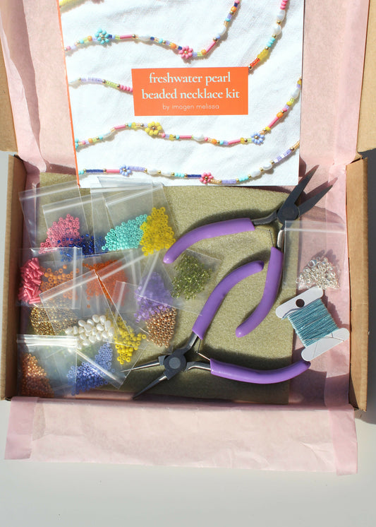 Beaded necklace kit with tools and materials in a box