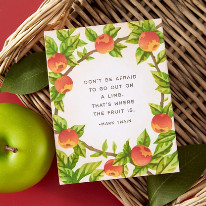 Card with peach illustration and Mark Twain quote on a woven basket with apples